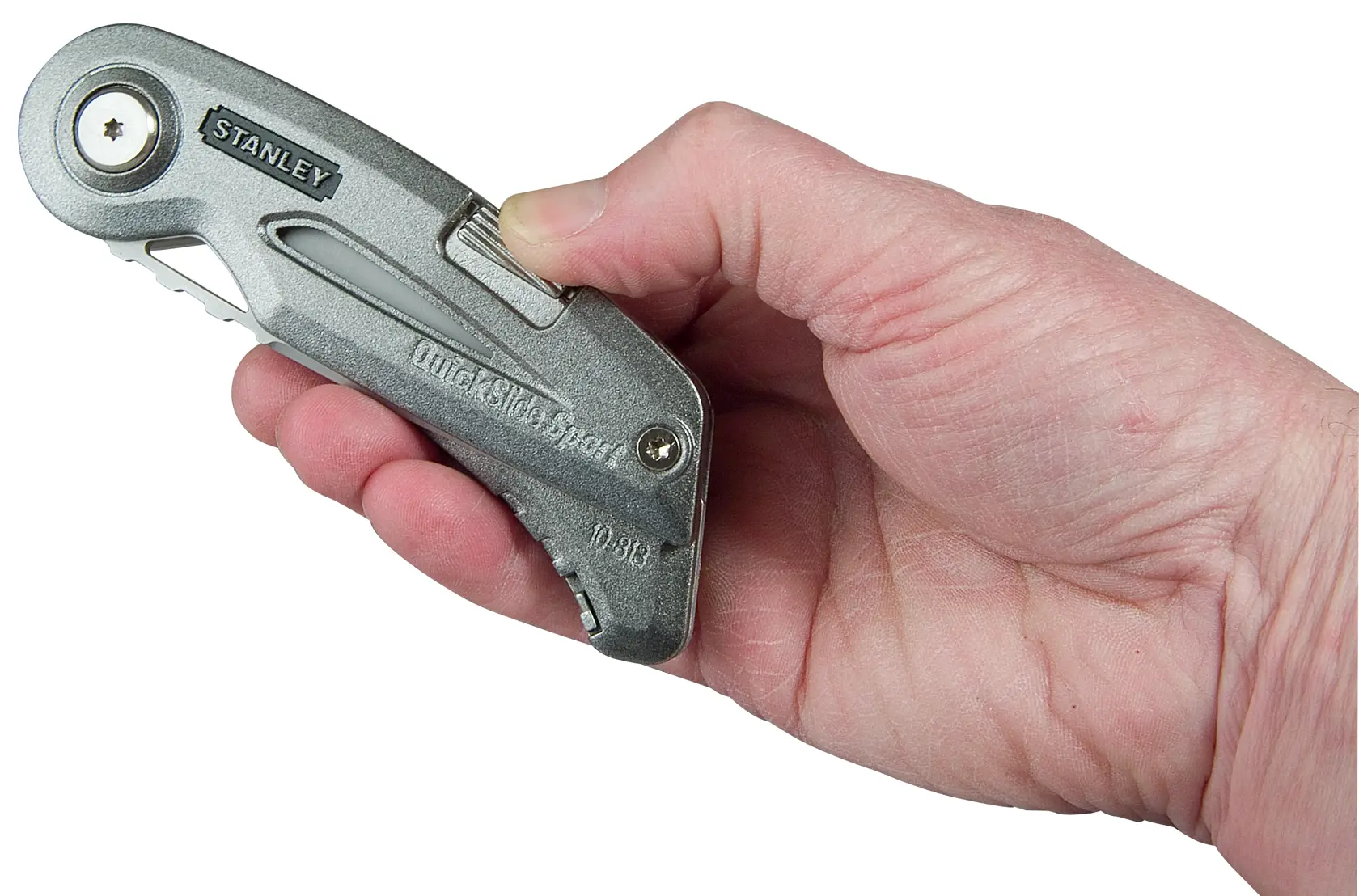 Photo of STANLEY 0-10-813 utility knife held in a hand, silver metal body, side view.