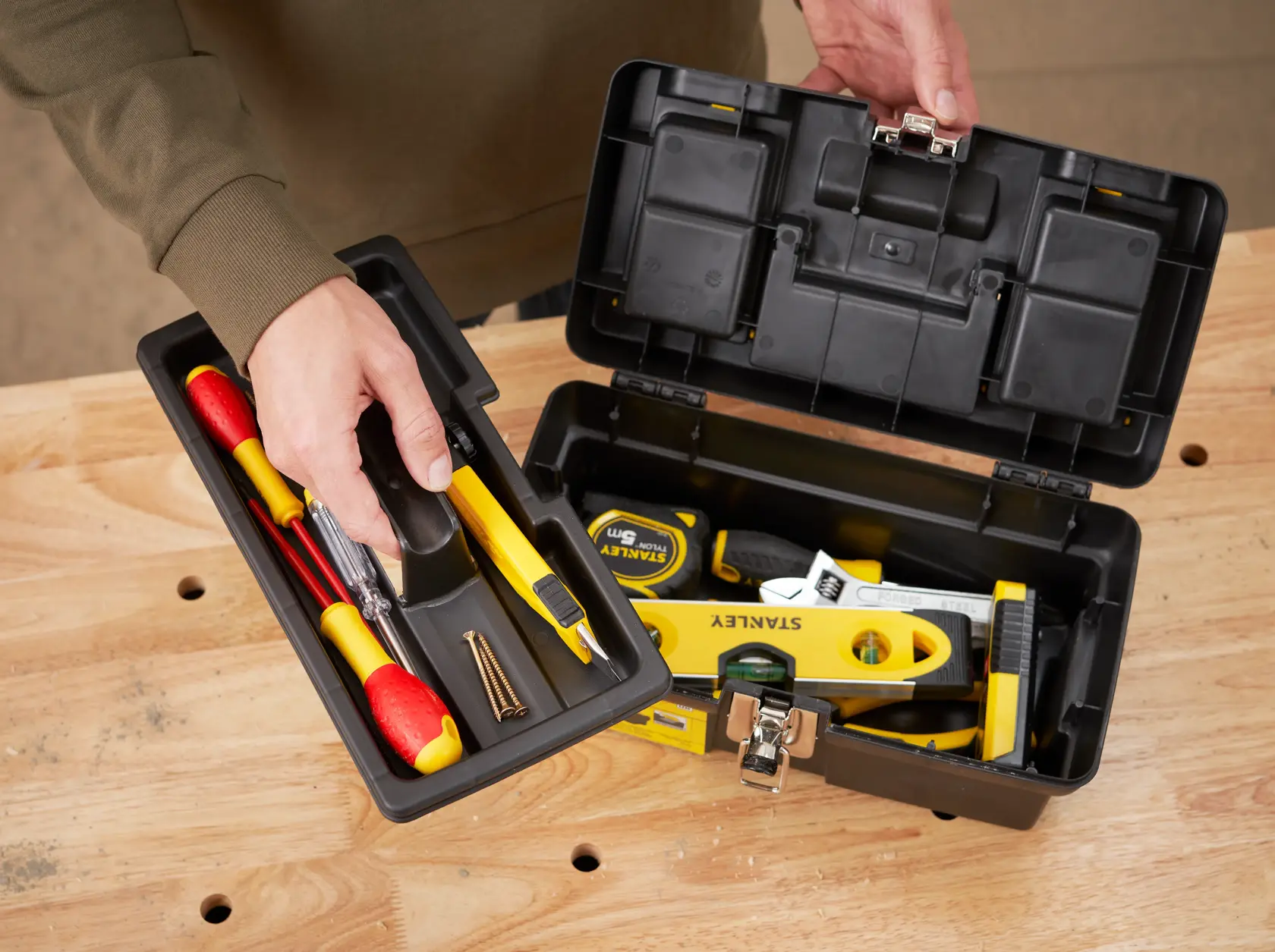 STANLEY 1-92-064 tool box open on table, showing tray with tools and interior compartment.