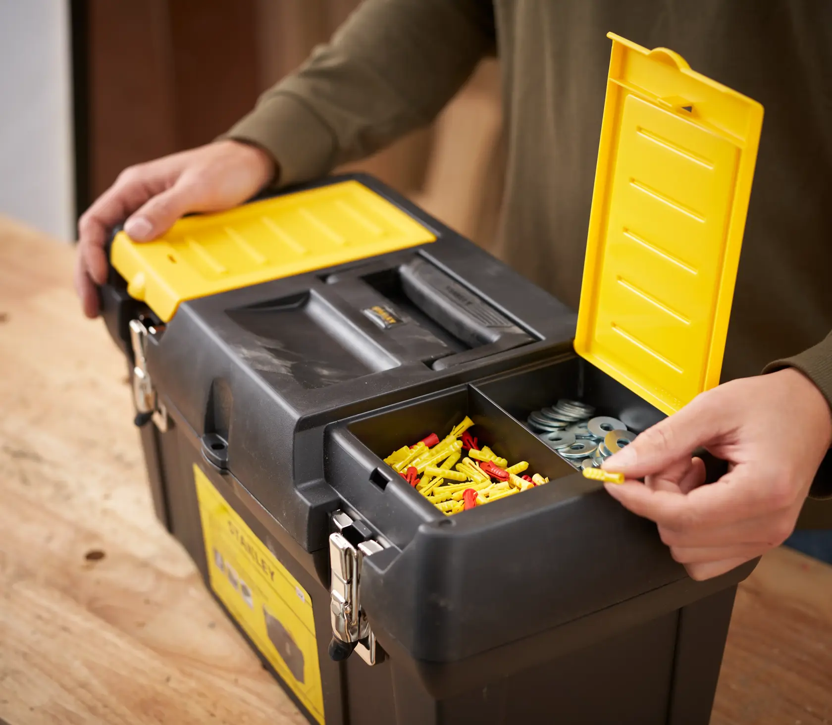 STANLEY 1-92-066 black toolbox with yellow lid compartments on workbench, photography rear angle.