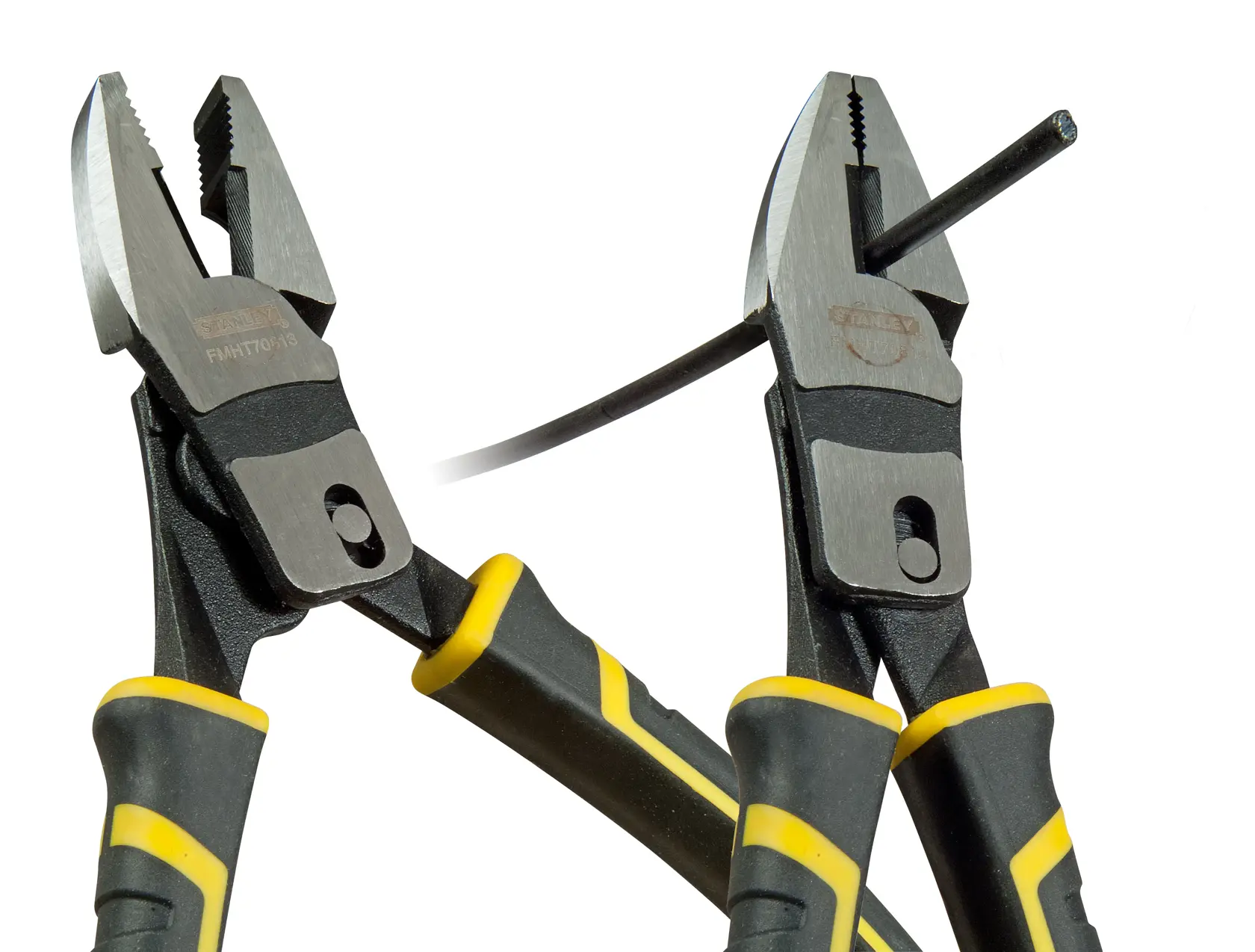 Two STANLEY pliers with black and yellow handles, one cutting a wire. Close-up on tool details.