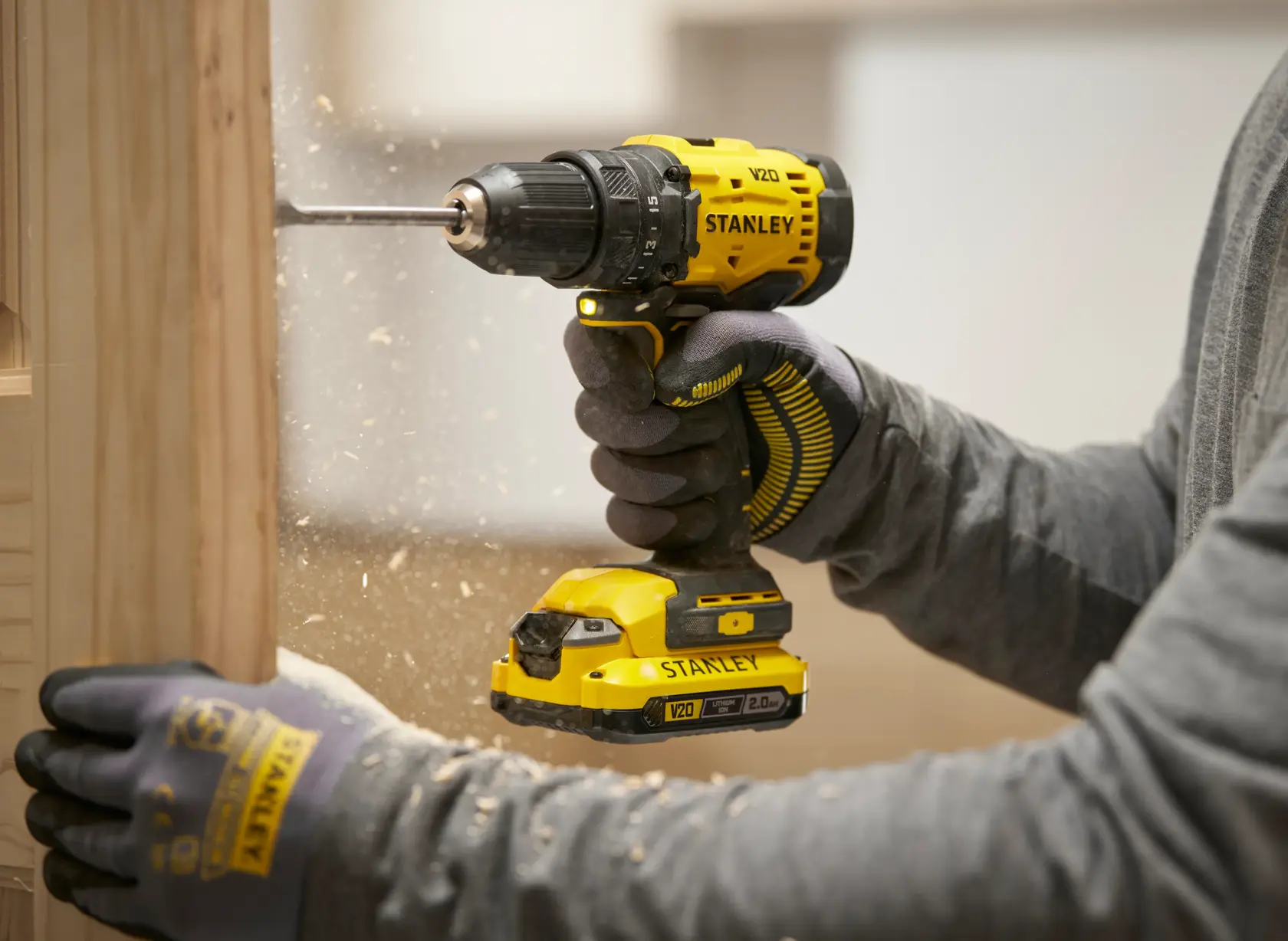 STANLEY cordless drill in use. Photography. SKUs: STA52275, STA52275-XJ.