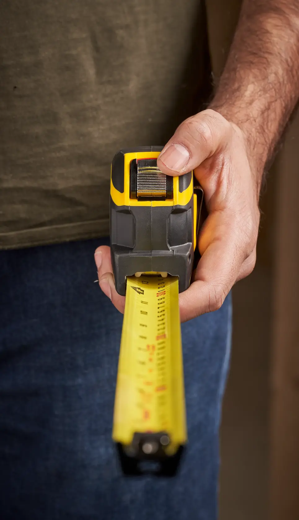 STANLEY XTHT0-33504 tape measure photography, front view, yellow and black casing, extended blade.